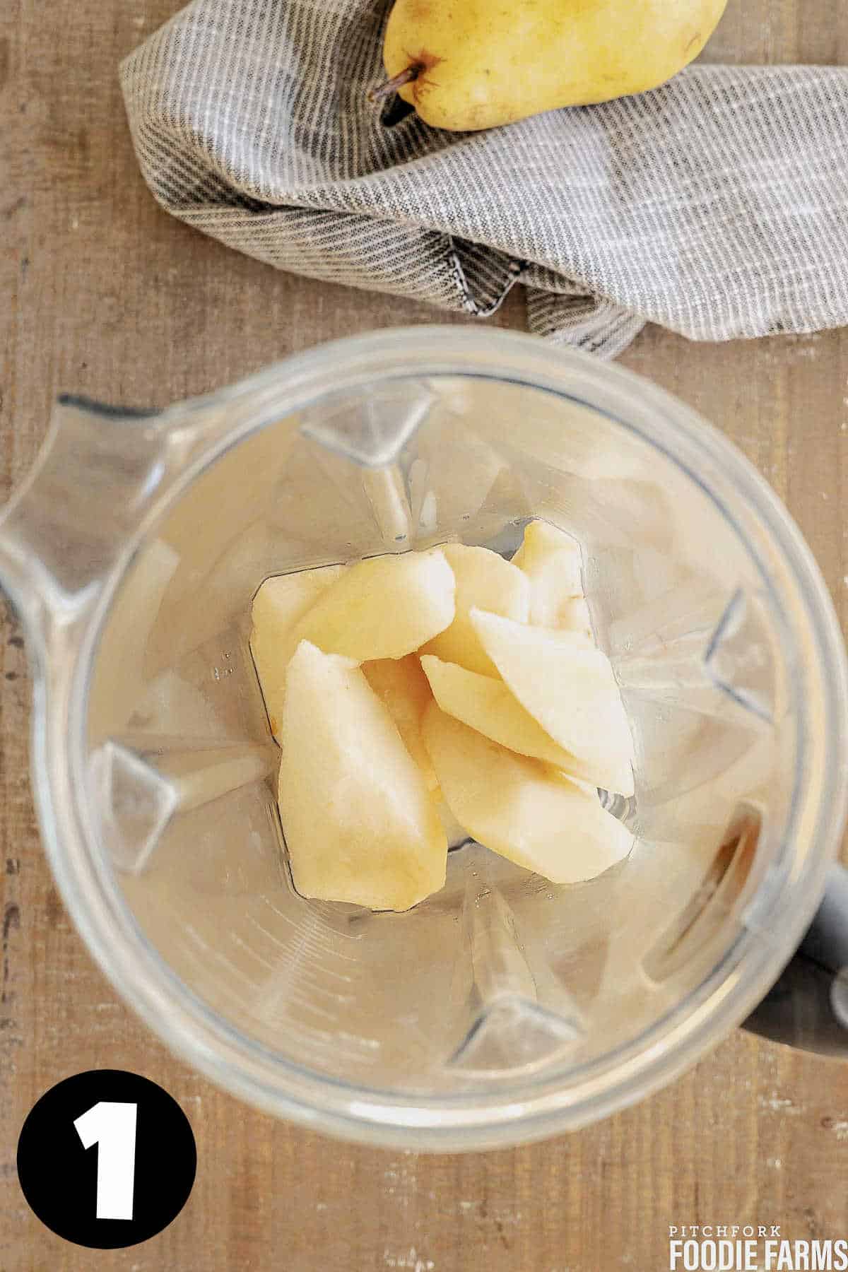 Sliced fresh pears in a blender.