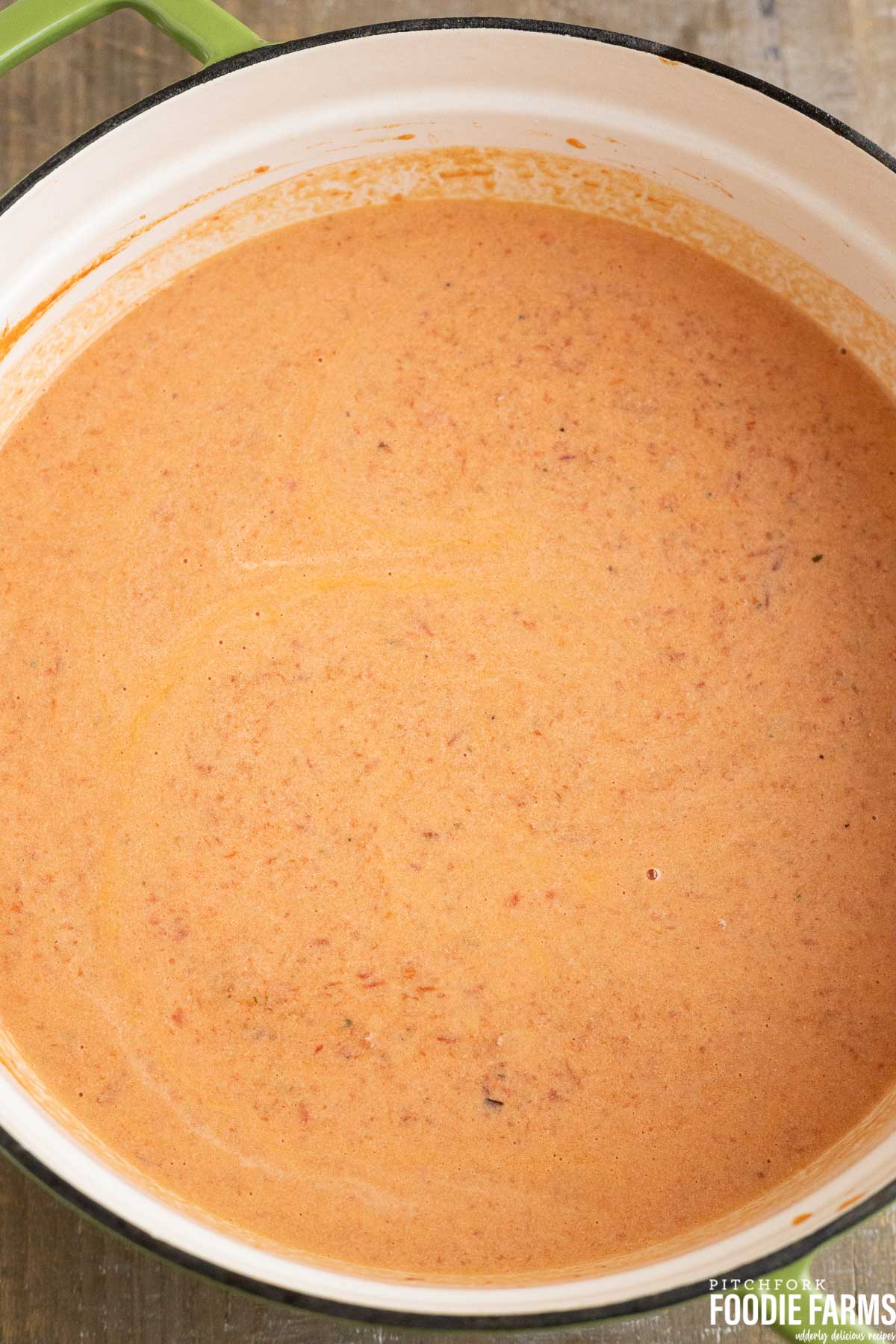 Homemade cream of tomato soup in a large stock pot.