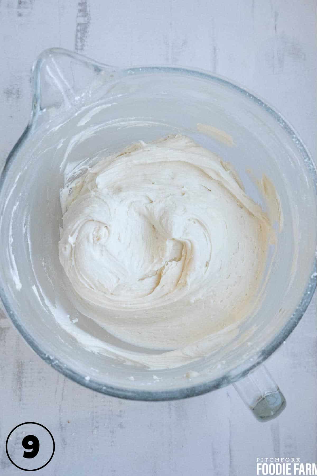 Buttercream icing in a mixing bowl.