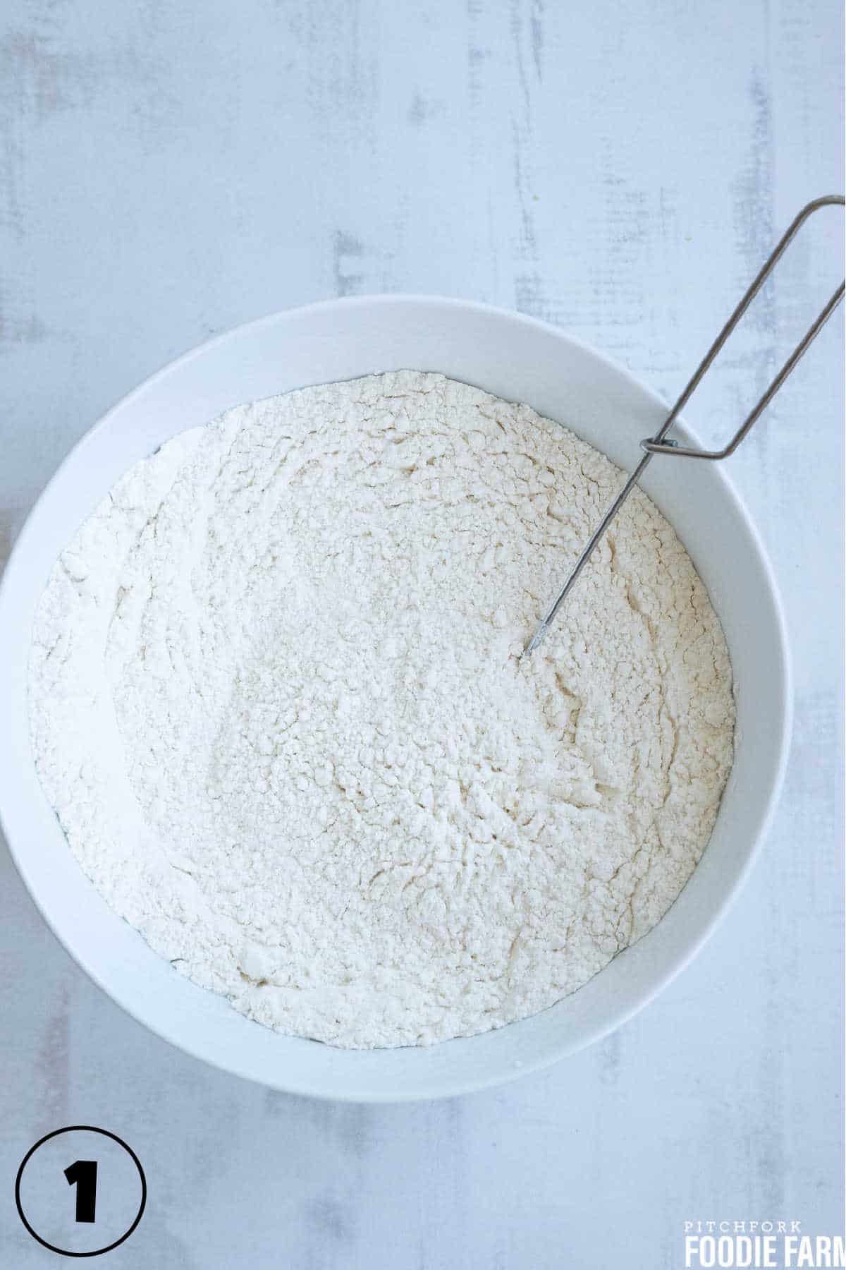Flour, salt, and baking powder in a mixing bowl.