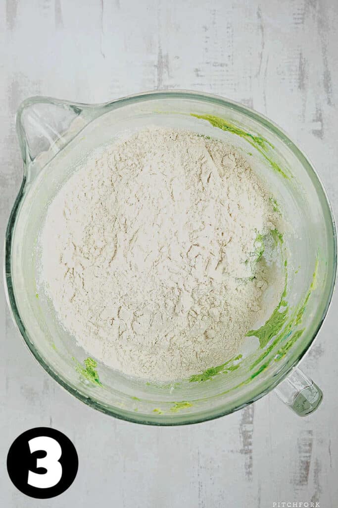 Green cookie dough with flour.