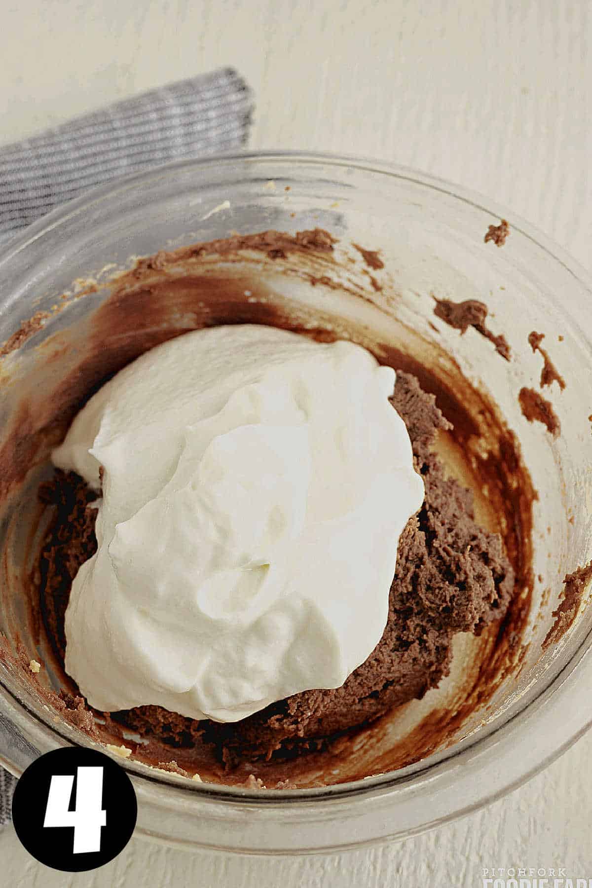 Fluffy chocolate mixture with Greek yogurt on top of it.