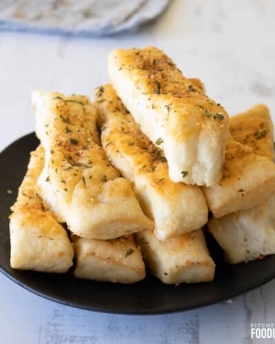 Garlic breadsticks with herbs and cheese.