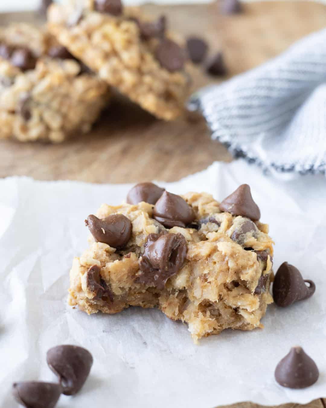 Peanut butter banana cookies with chocolate chips and oatmeal with a bit taken out of it.