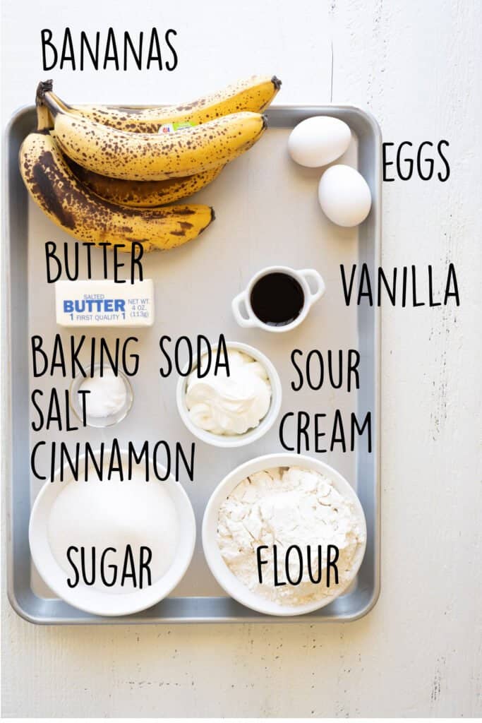 Ingredients needed to make banana cake on a sheet pan.