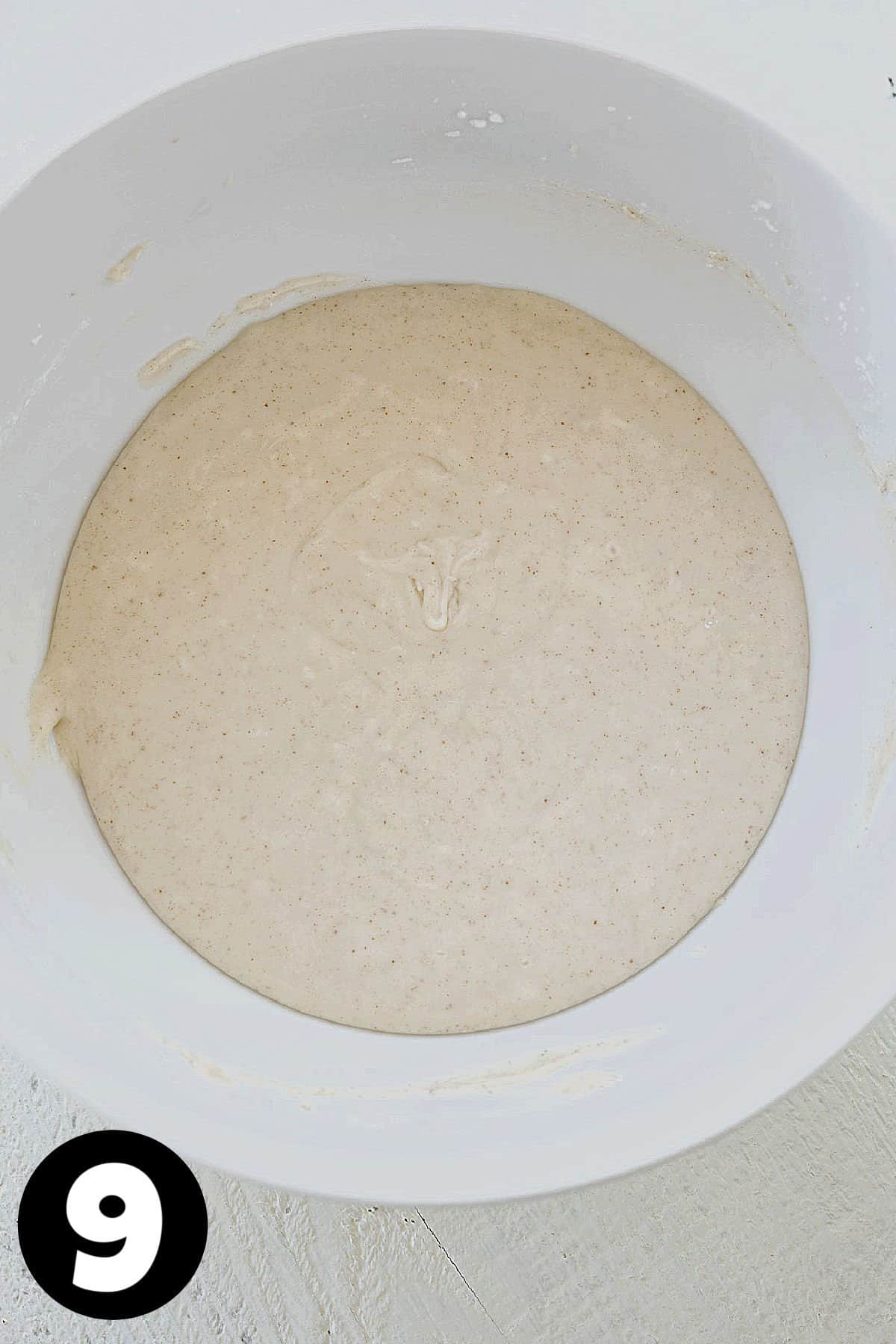 Brown butter cream cheese frosting in a mixing bowl.