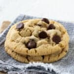 Chocolate chip cookies on a blue and white napkin.