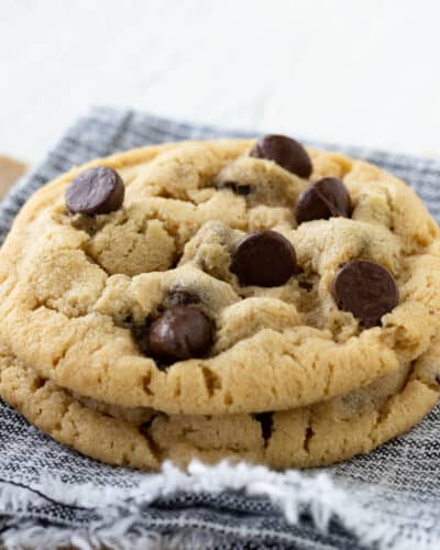 Chocolate chip cookies on a blue and white napkin.