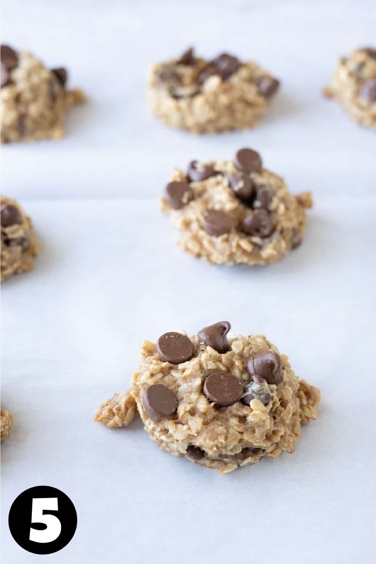 Baked banana oat cookies on a baking sheet.