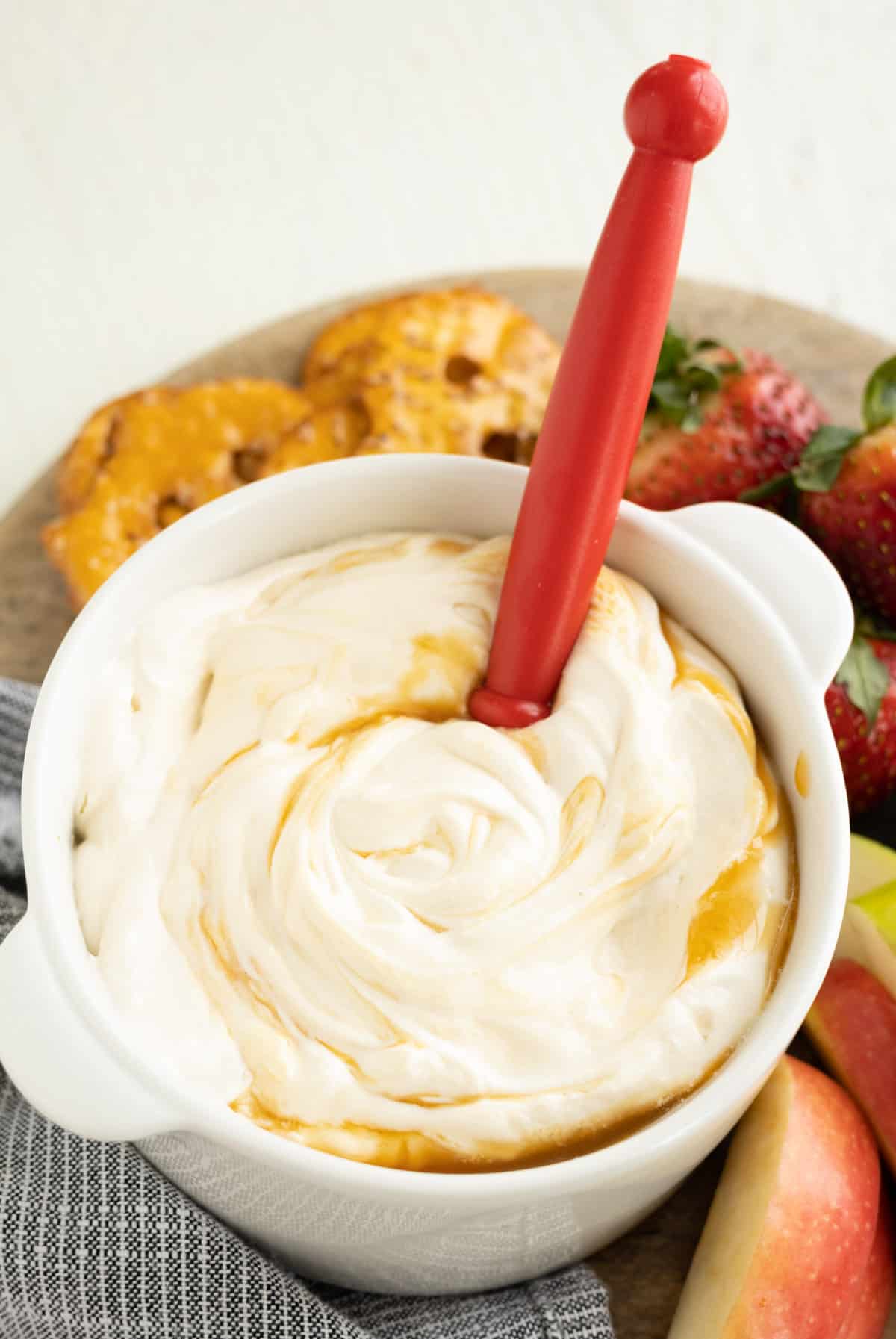 Creamy caramel apple dip in a white bowl.