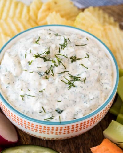 Vegetable dip with fresh dill on the top.