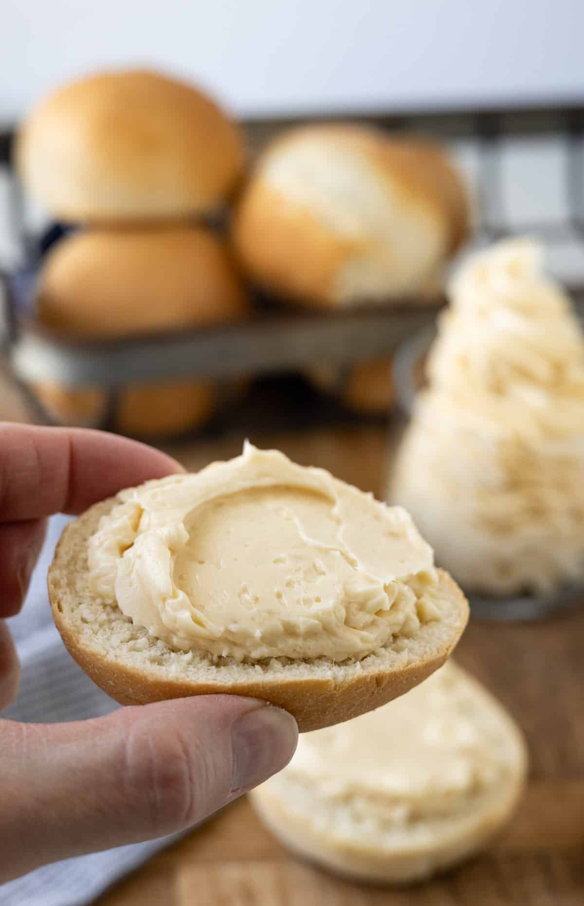 A roll that's spread with honey butter.