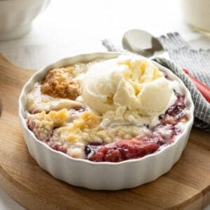 Dump cake with rhubarb, blueberry pie filling, strawberry Jell-O and dry boxed cake mix topped with vanilla ice cream.