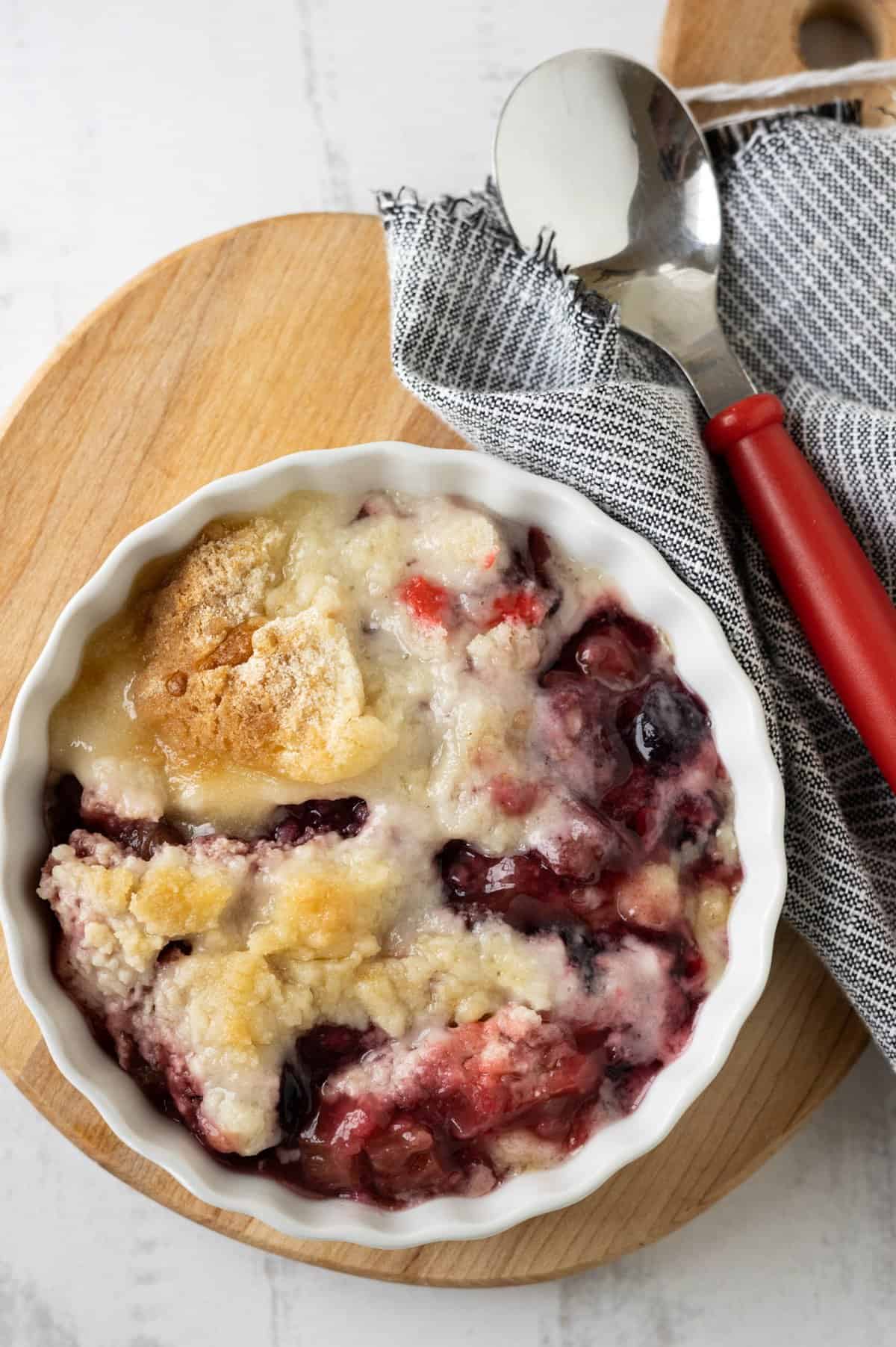 A white dish with rhubarb dump cake.