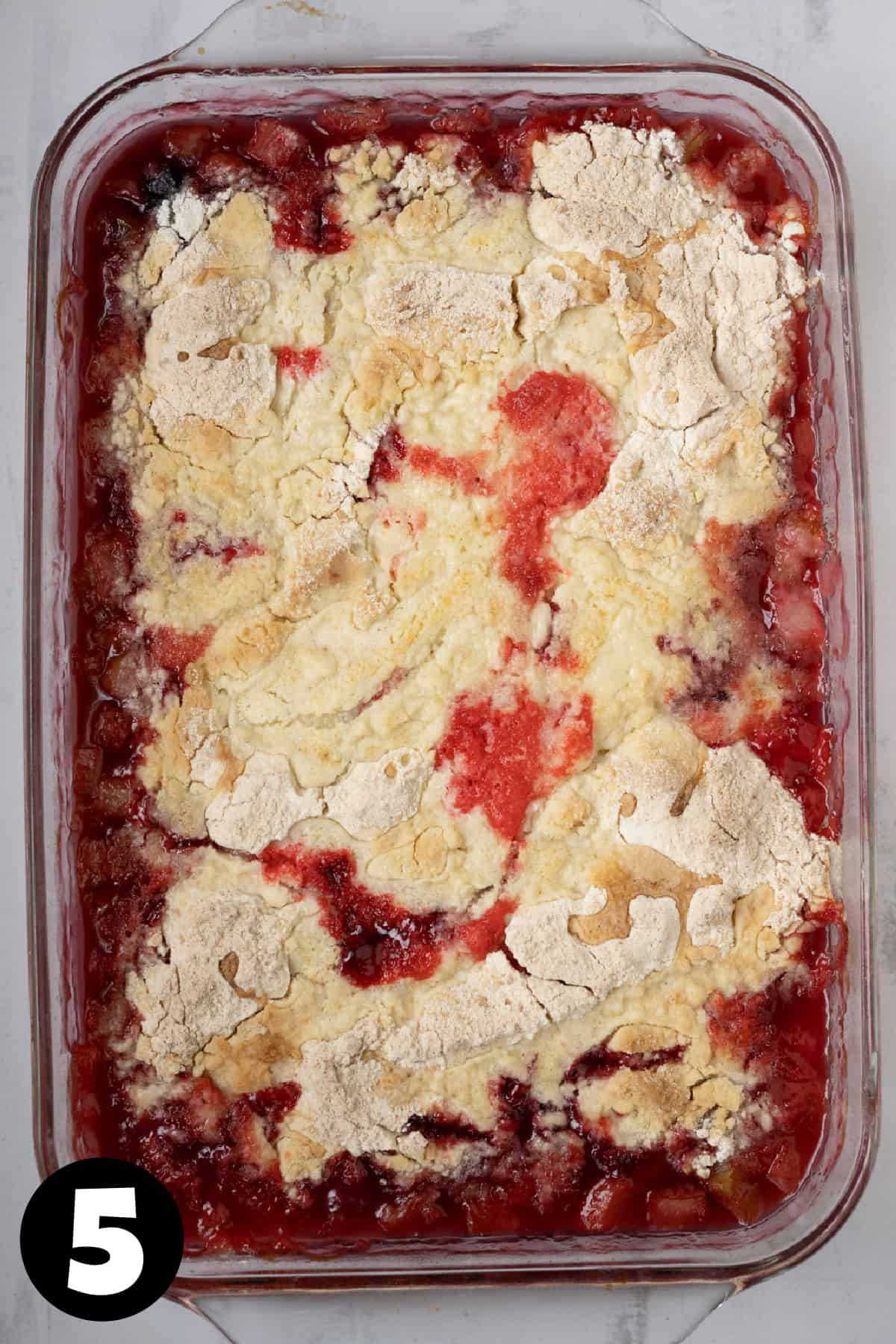 Baked rhubarb dump cake with crisp cake mix on top.