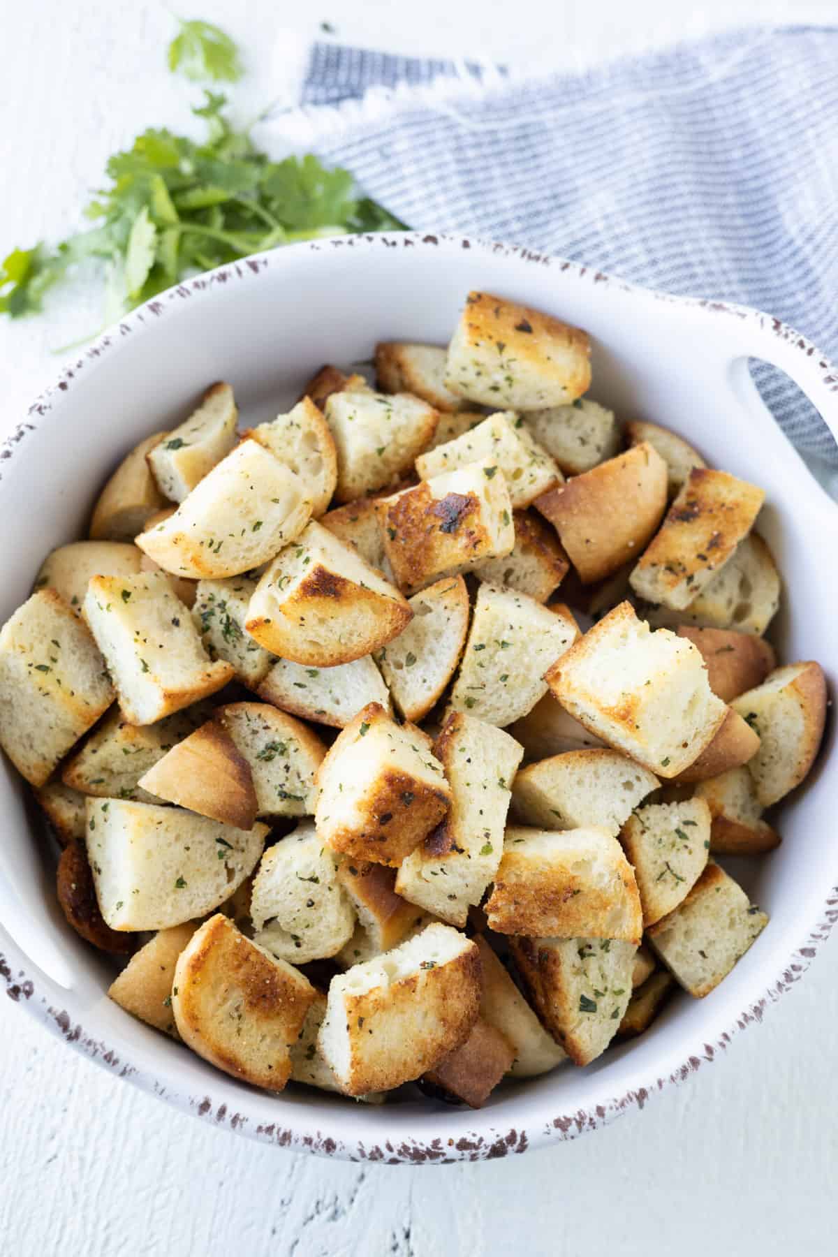 Golden Brown Baked Croutons in a white dish.