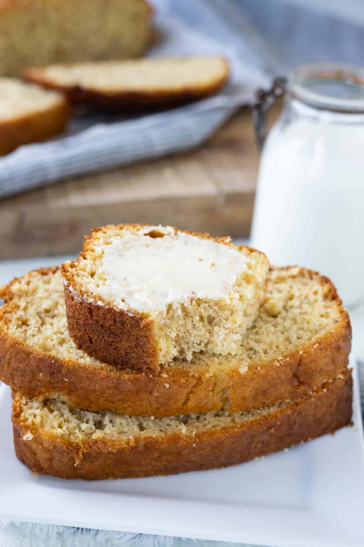 Slices of banana bread on a white plate.