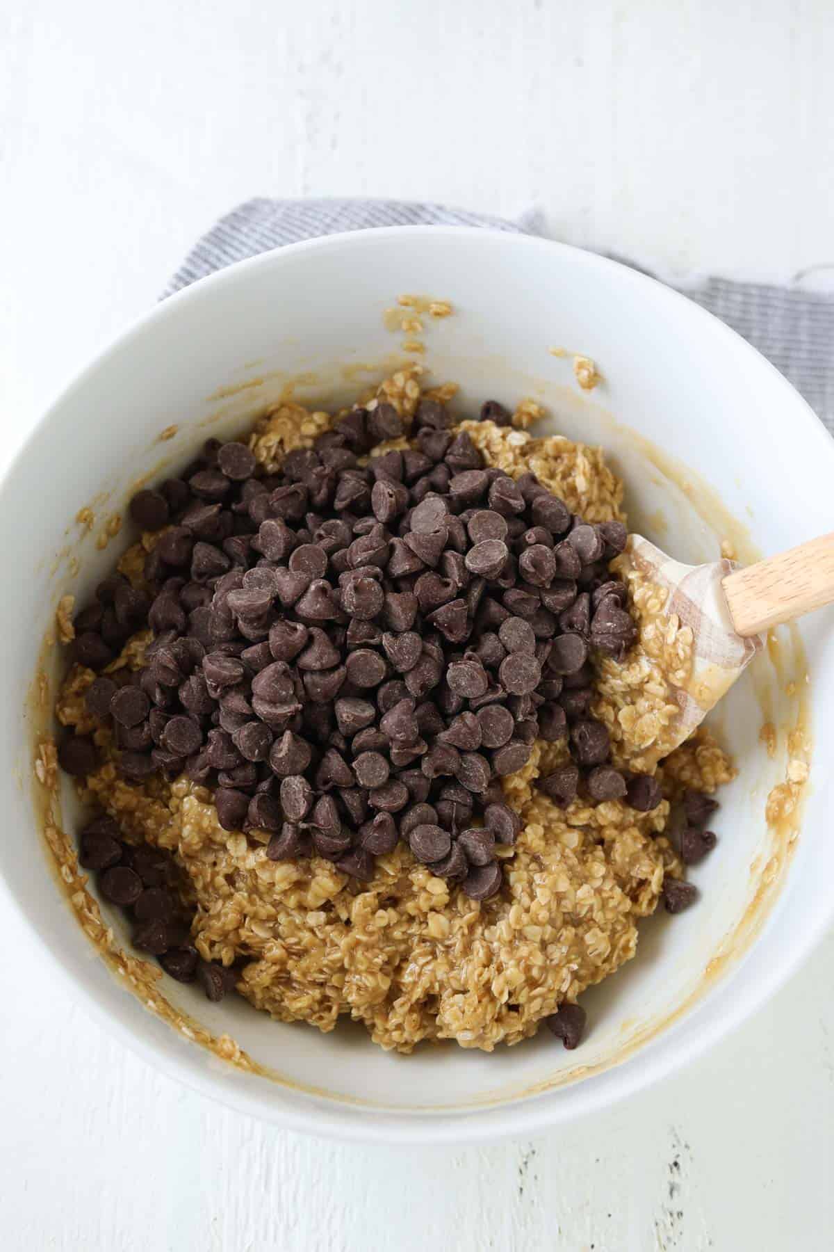 A bowl with oatmeal and chocolate chips.