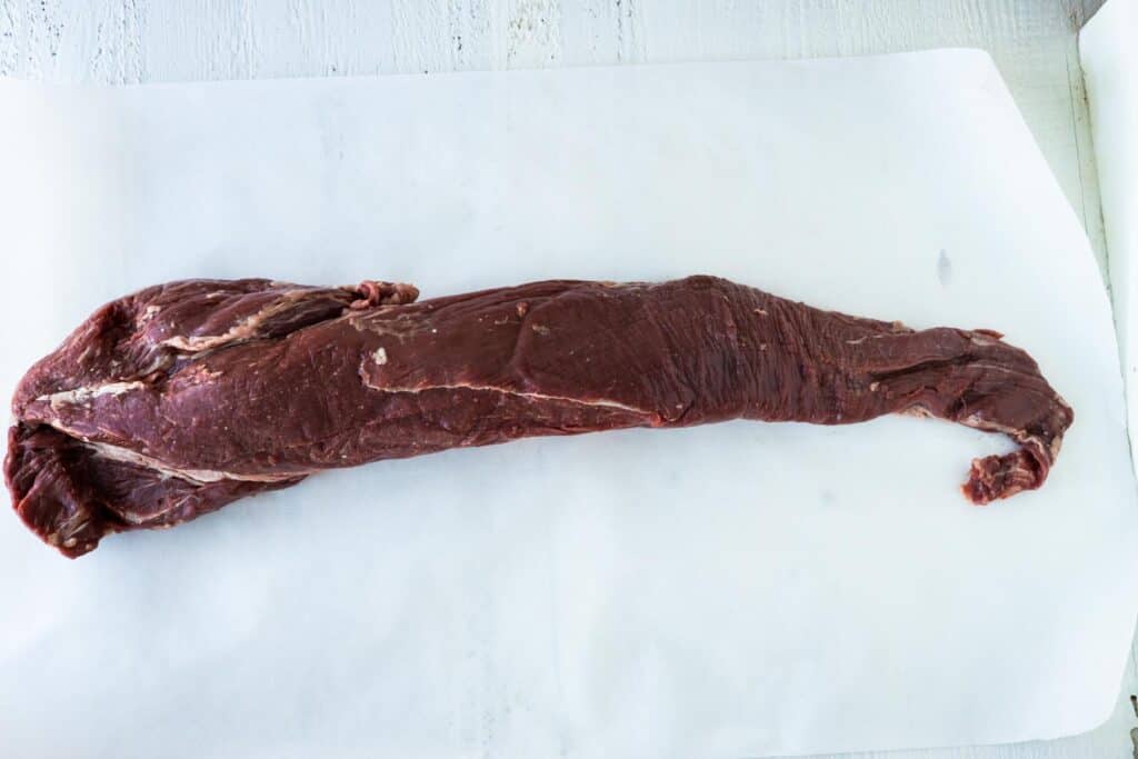 A whole beef tenderloin with the tail for cutting into tips.