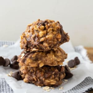 Three caramel with chocolate chips and toffee chips no bake cookies stacked on top of each other.