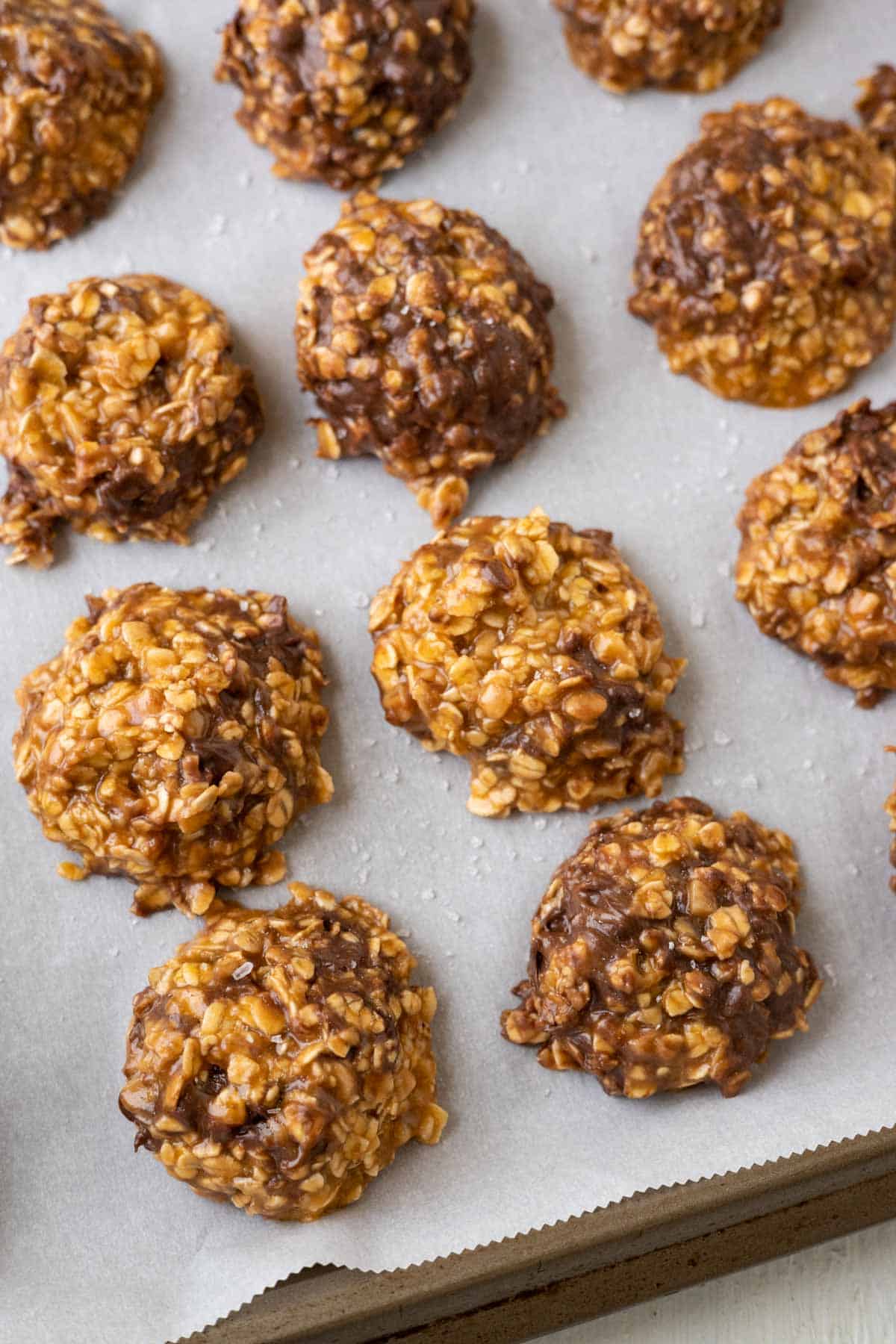 No bake cookies with butterscotch, oats, and chocolate chips on a cookie sheet.