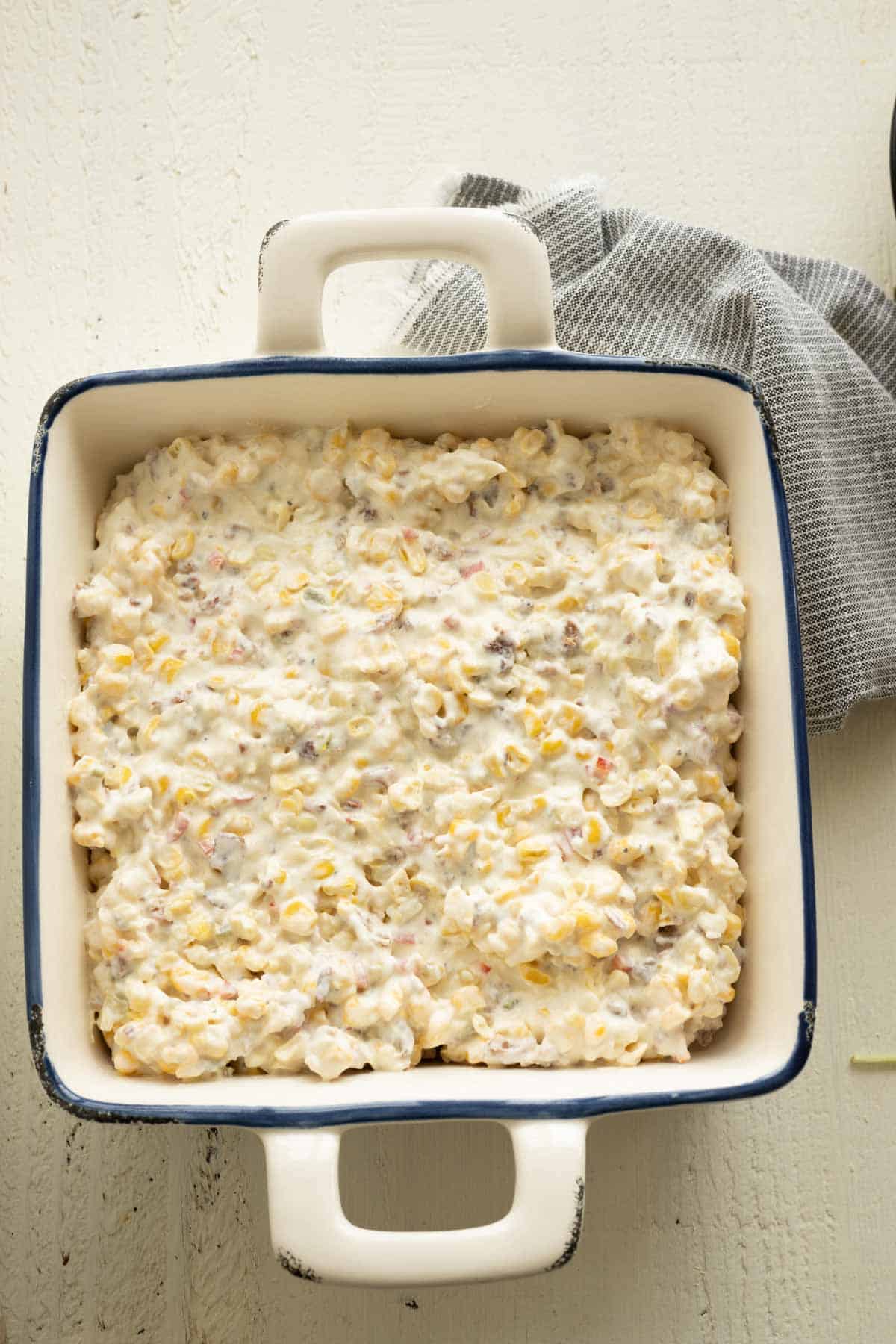 Corn dip spread in a baking dish.