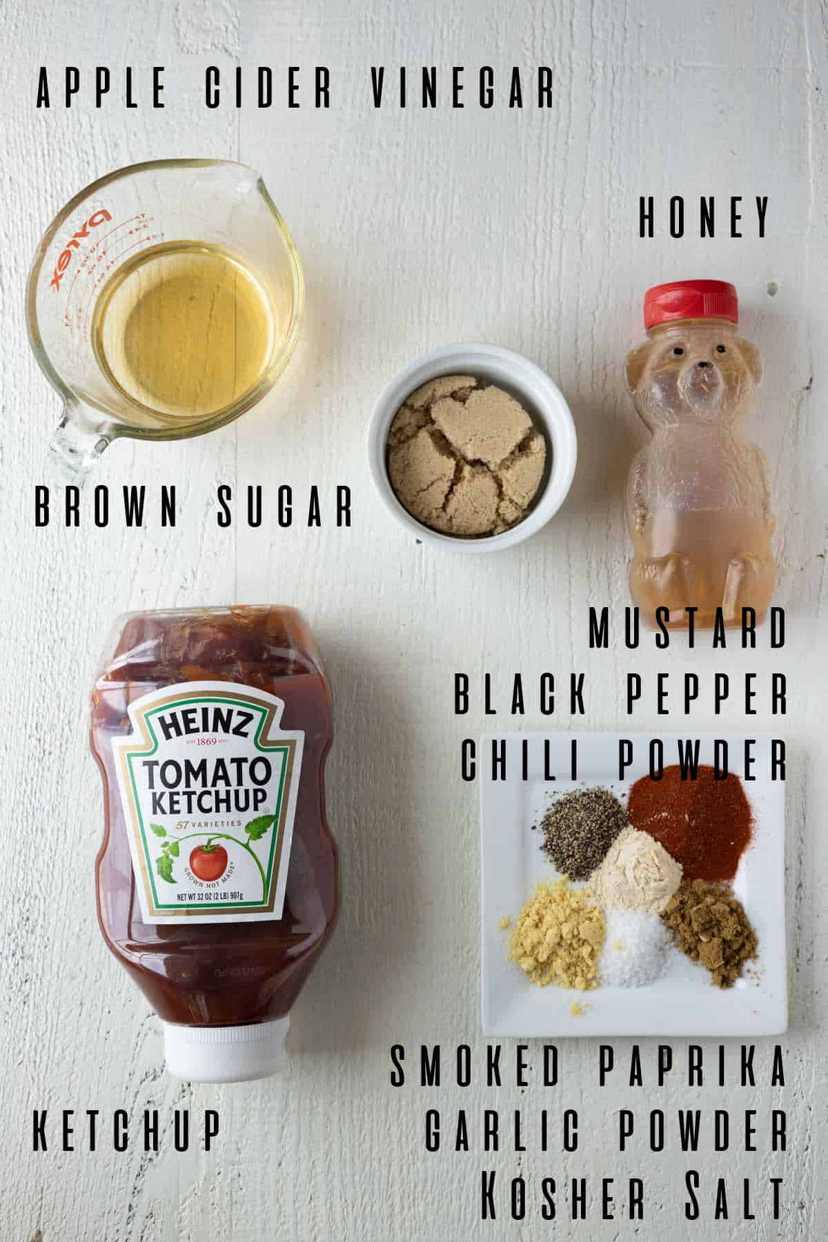 Ingredients needed to make homemade bbq sauce including ketchup, apple cider vinegar, brown sugar, and honey.
