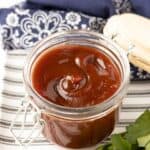 A jar of barbecue sauce that's sweet and tangy.