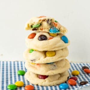 A stack of sugar cookies with M&Ms.