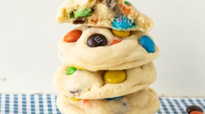A stack of sugar cookies with M&Ms.