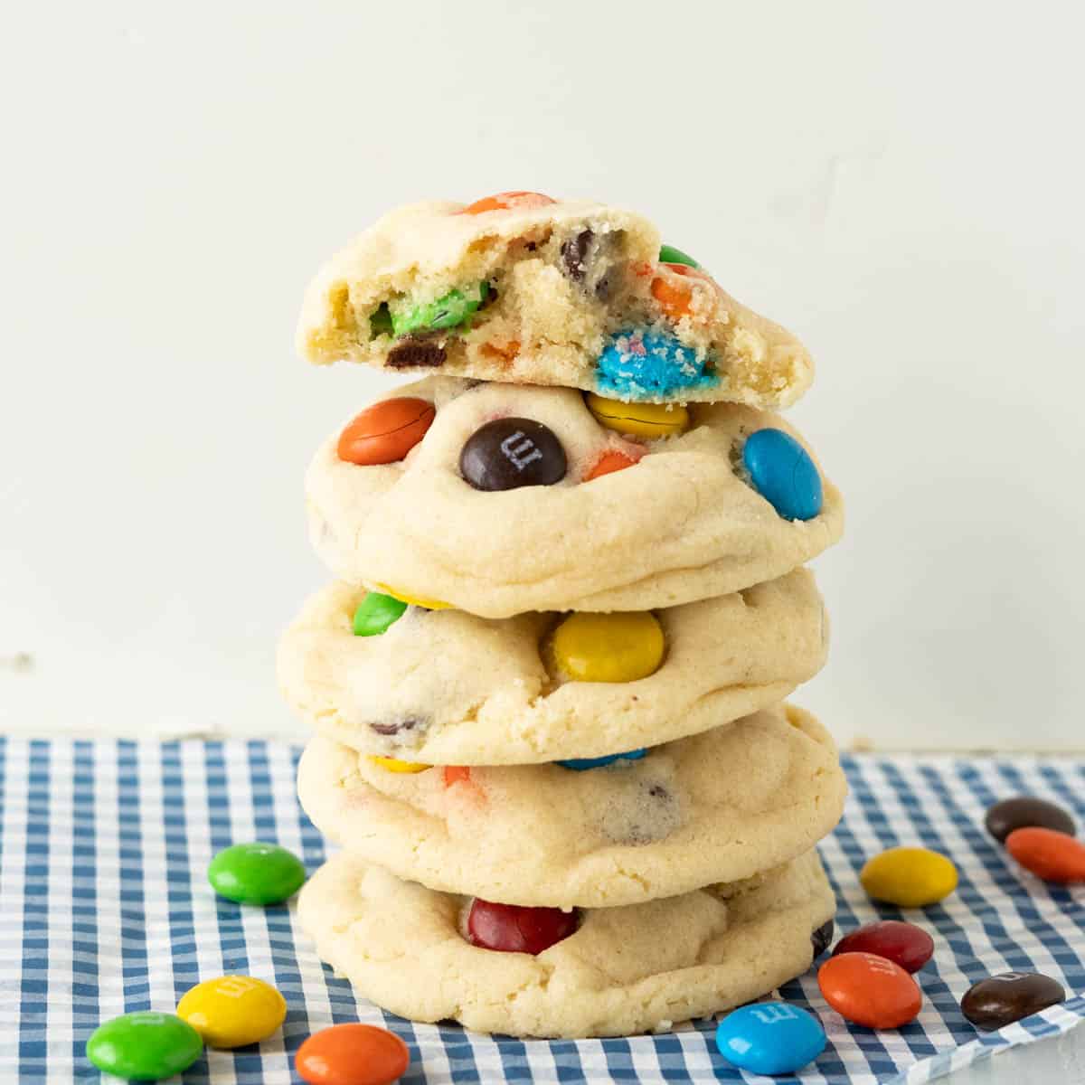 A stack of sugar cookies with M&Ms.