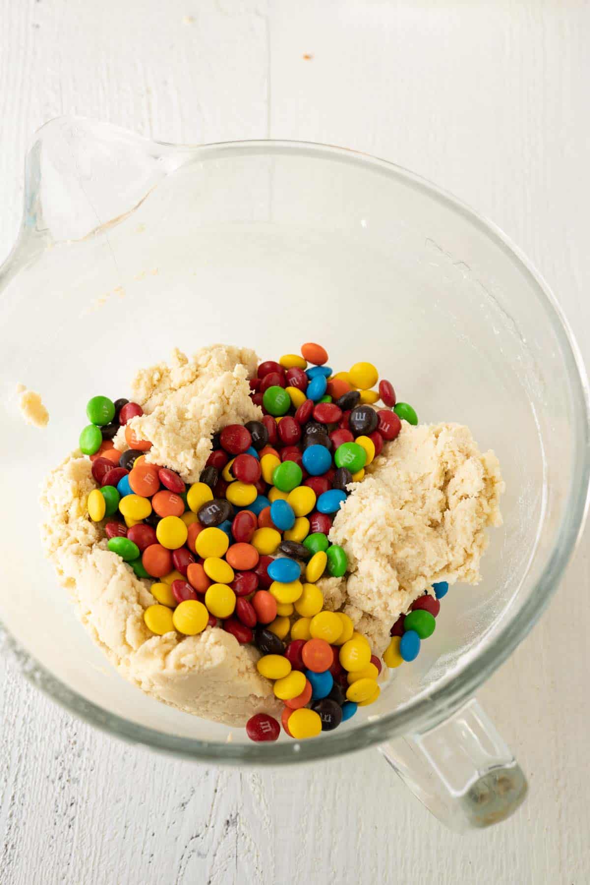 Sugar cookie dough with M&M pieces on top.