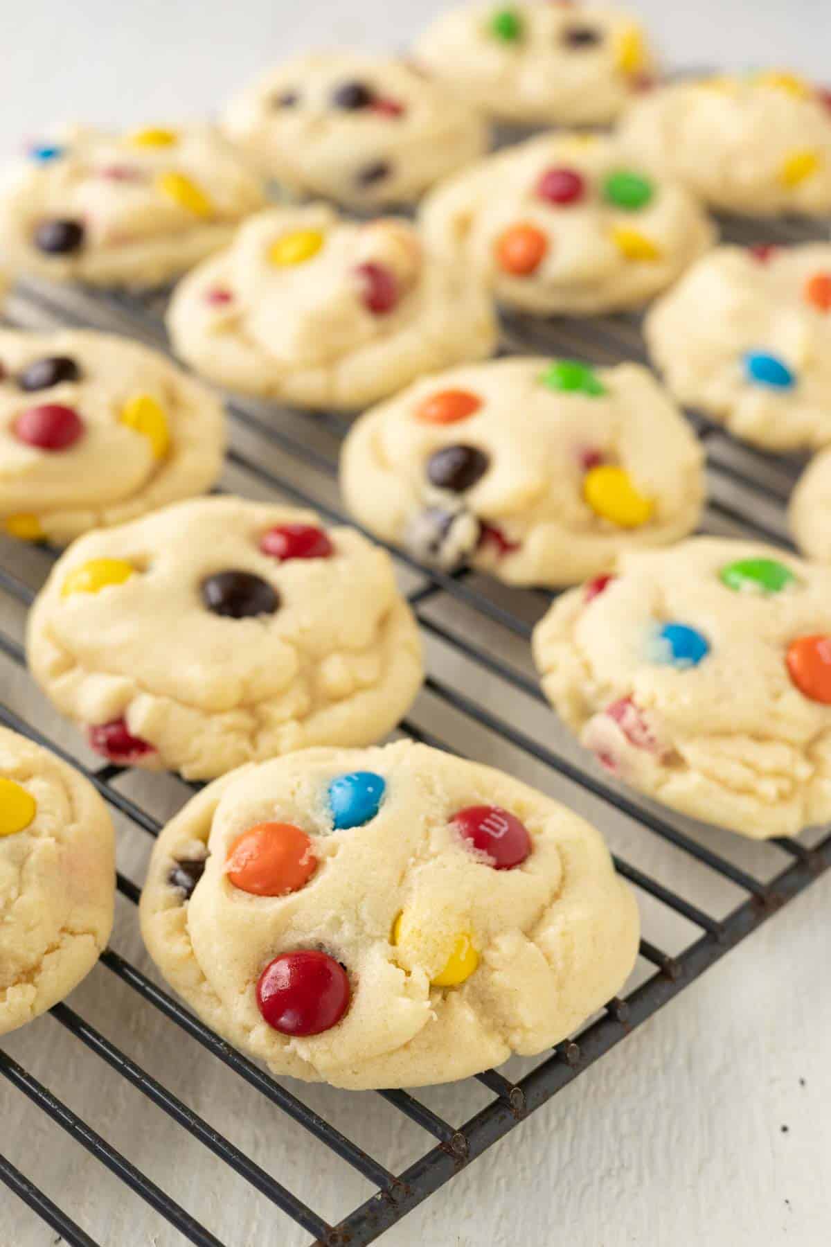 M&M cookie on a wire cooling rack.