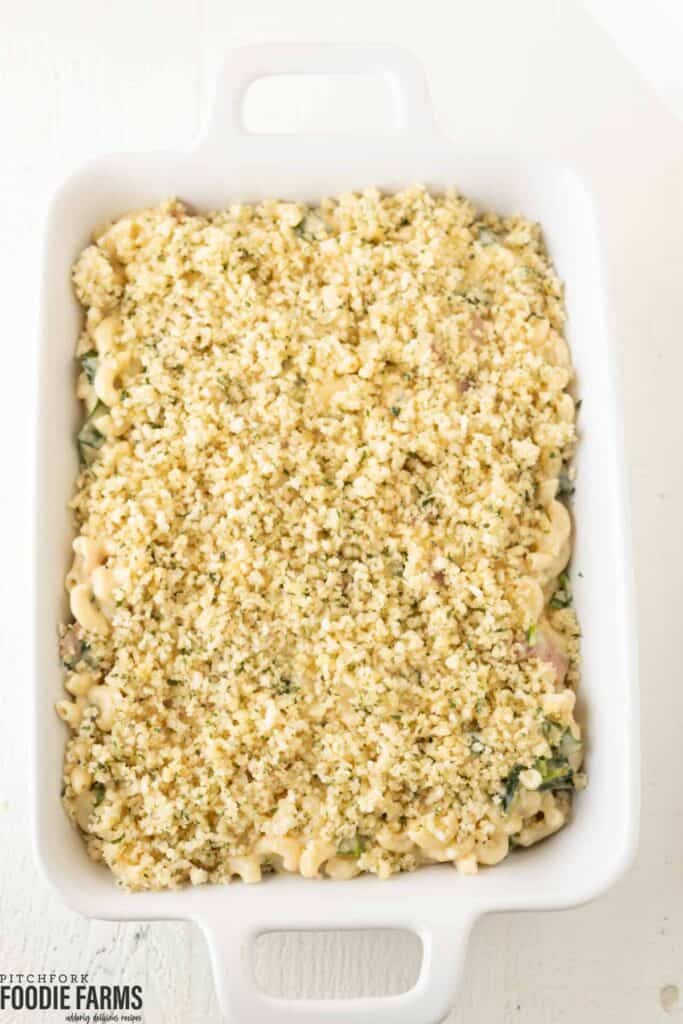A casserole dish with pasta and a crumb topping.