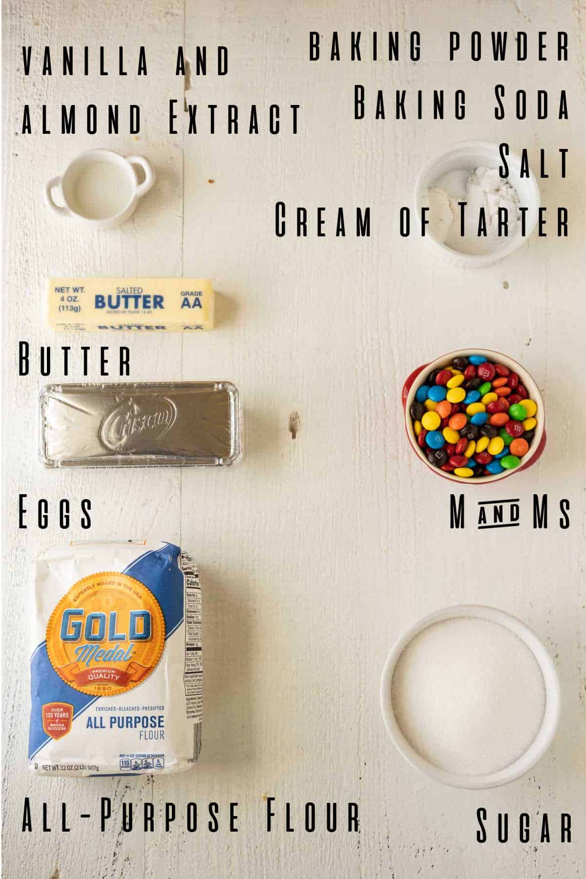 Ingredients needed to make sugar cookies with m and ms.