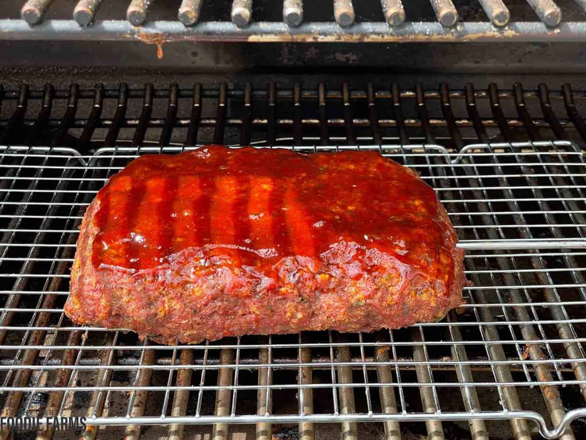 Glazed meatloaf on a Trager smoker grill.