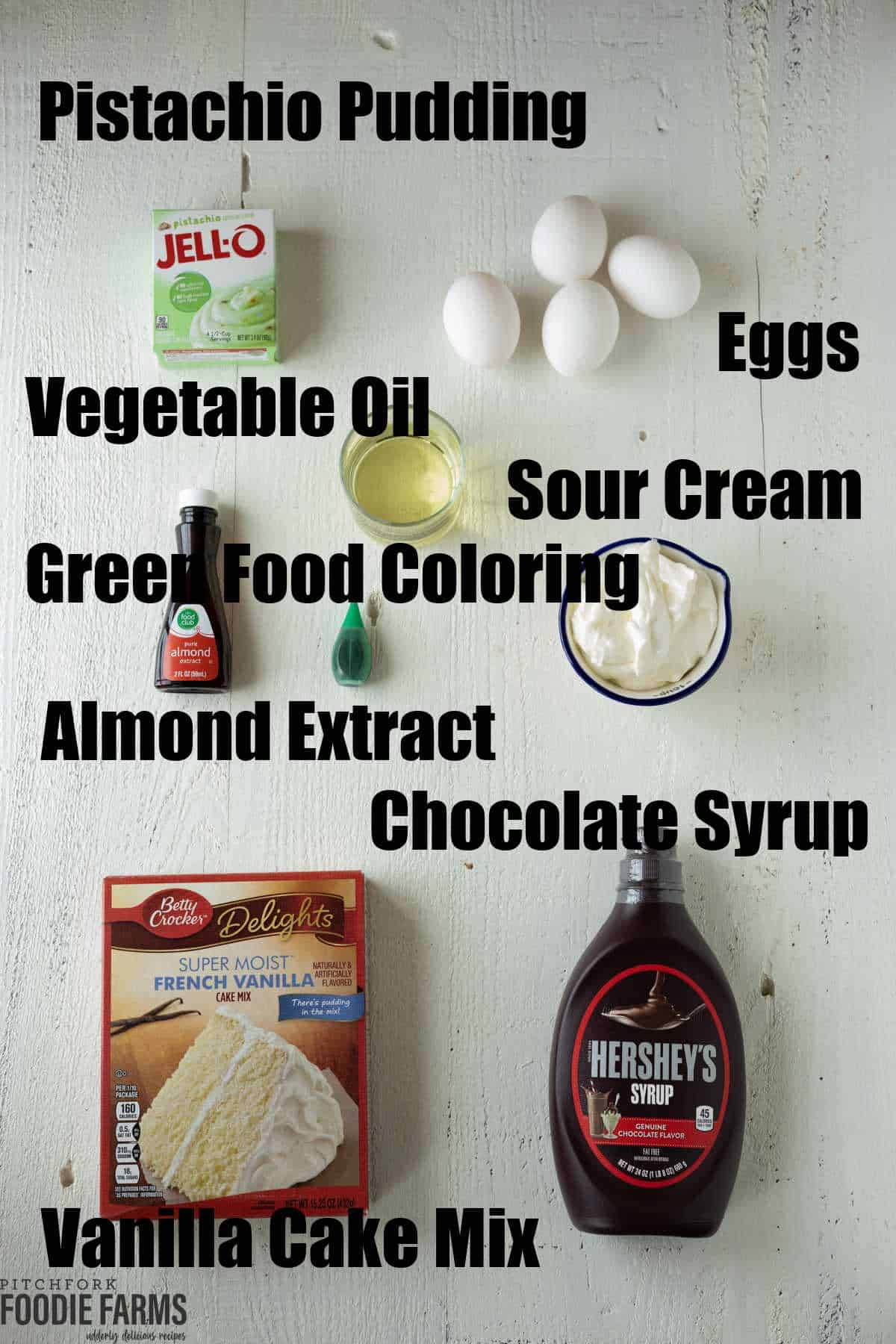 Ingredients needed to m make a pistachio cake with sour cream, cake mix, and instant pudding mix.