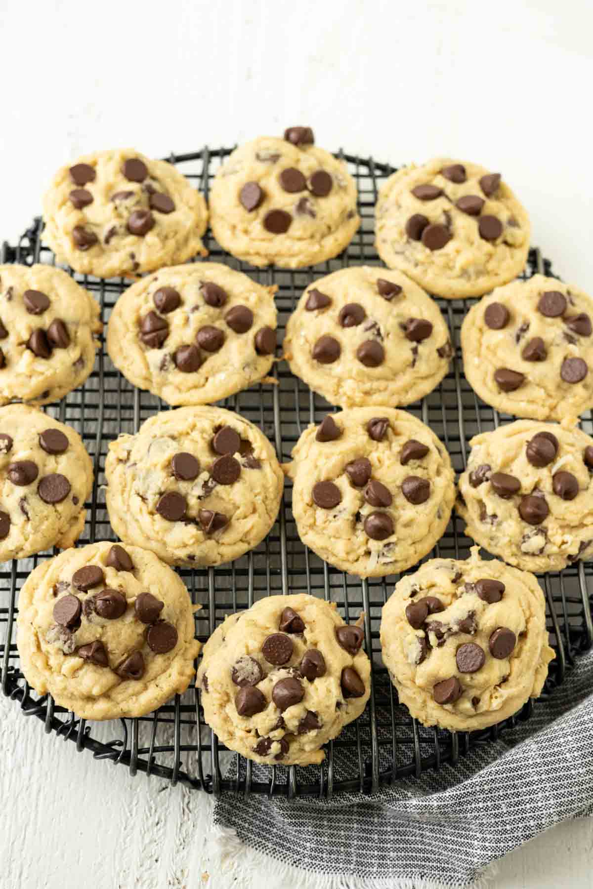 Chocolate chip cookies on a wire cooling rack.