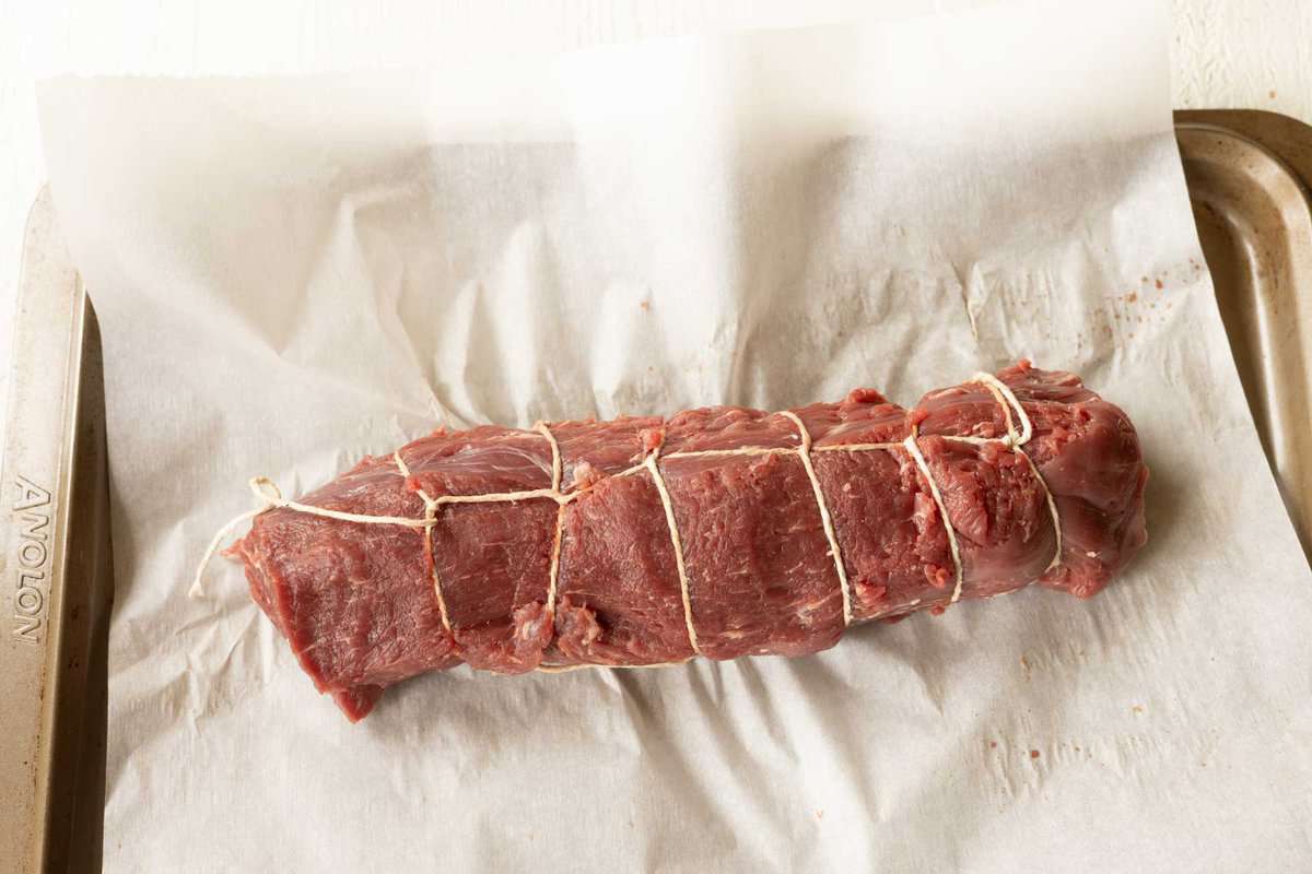 Beef tenderloin tied with butchers twine.