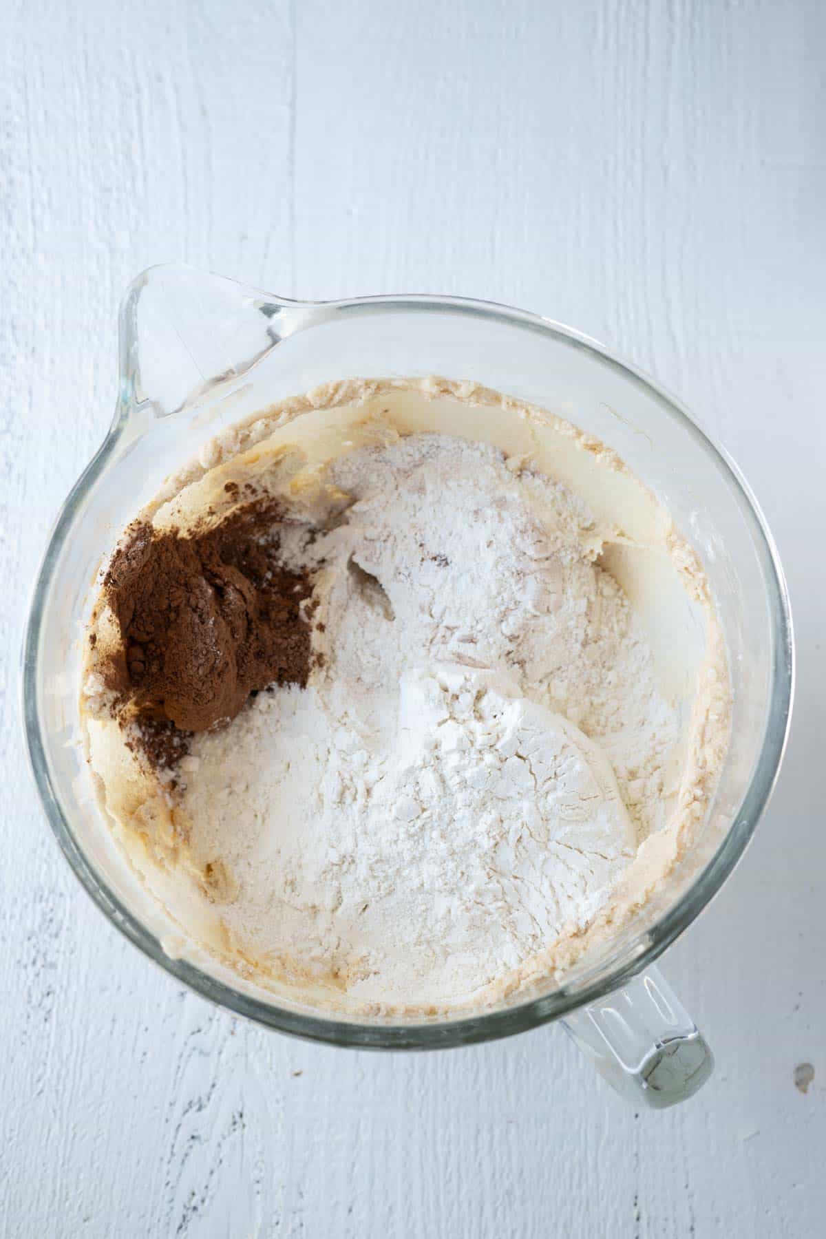 Flour, cocoa, and other dry ingedients with wet ingredients.